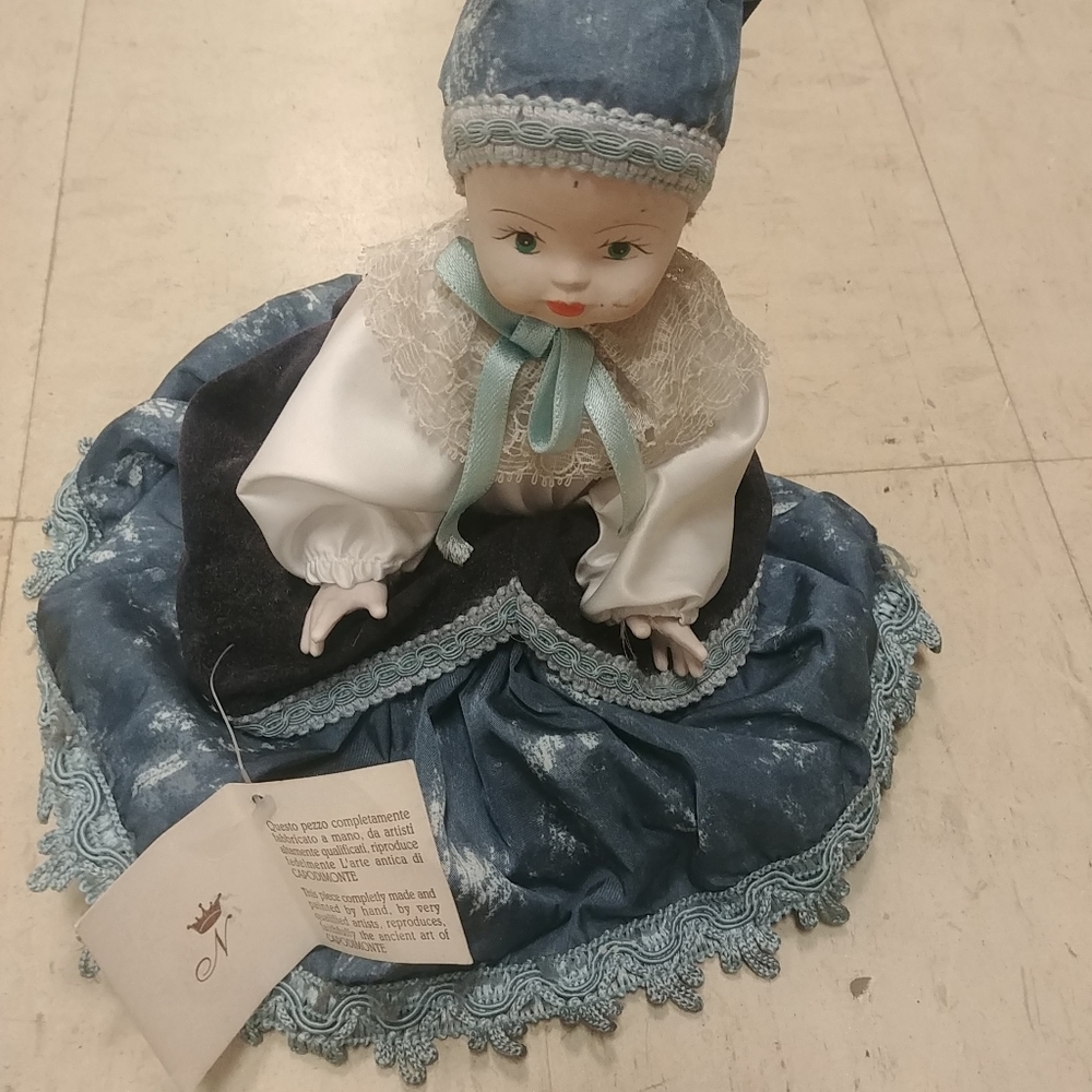Capodimonte La Bombola porcelain sitting doll